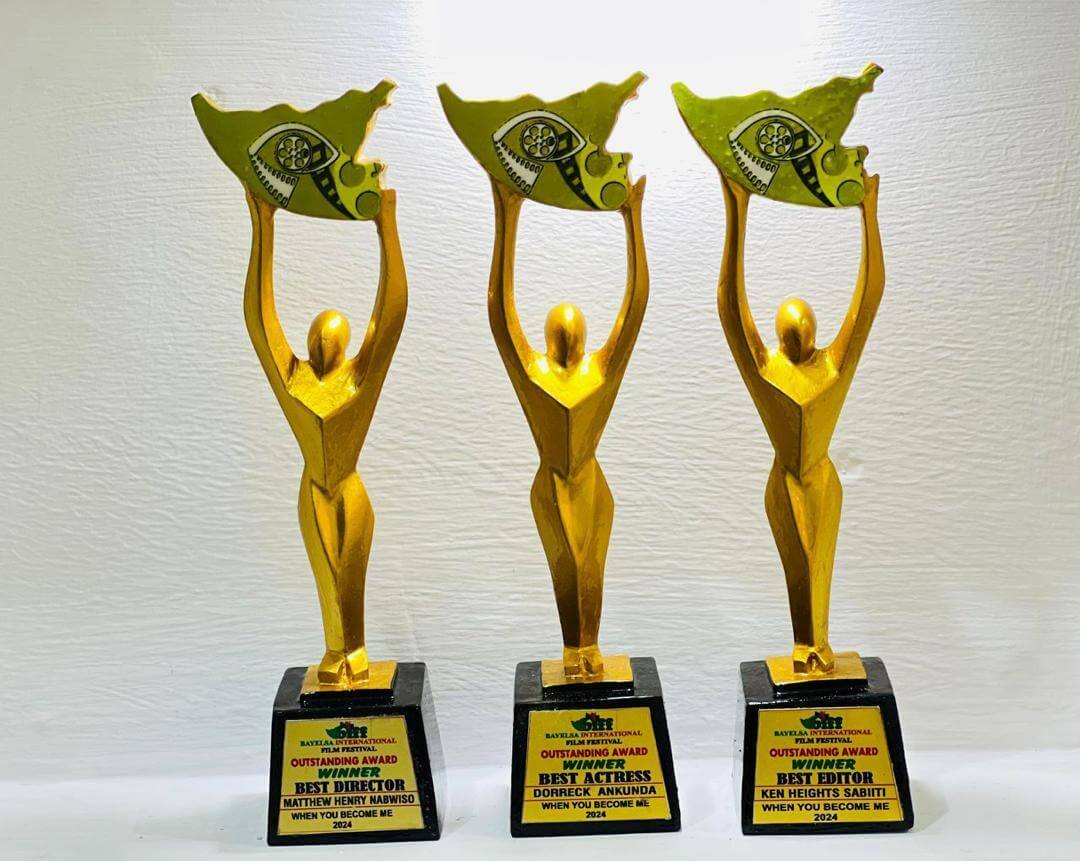 The image shows three golden awards tropies. The show a stylised person raising their arms and holding the signet of the film festival.