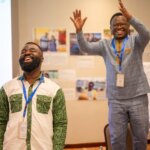 Mohammed Lansah, Learning and Documentation Officer for Ghana for We Can Work, on the left hand side of the photo and Ambrose Murangira, Technical Director Disability Inclusion at Light for the World, on the right hand side. Both are smiling broadly.