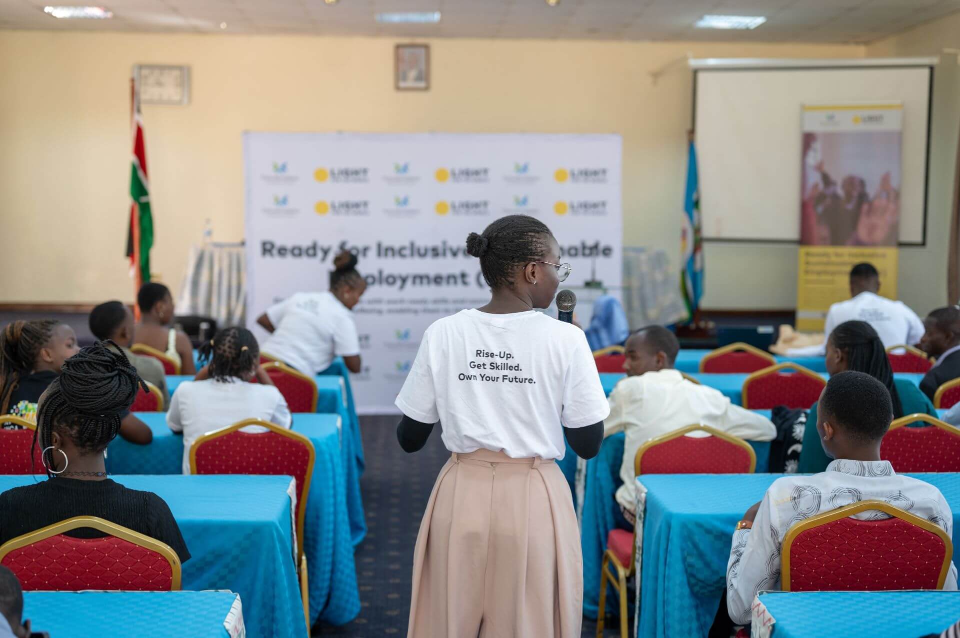 Dona Janet, RISE programme manager, facilitating the graduation ceremony at Kenyatta University.